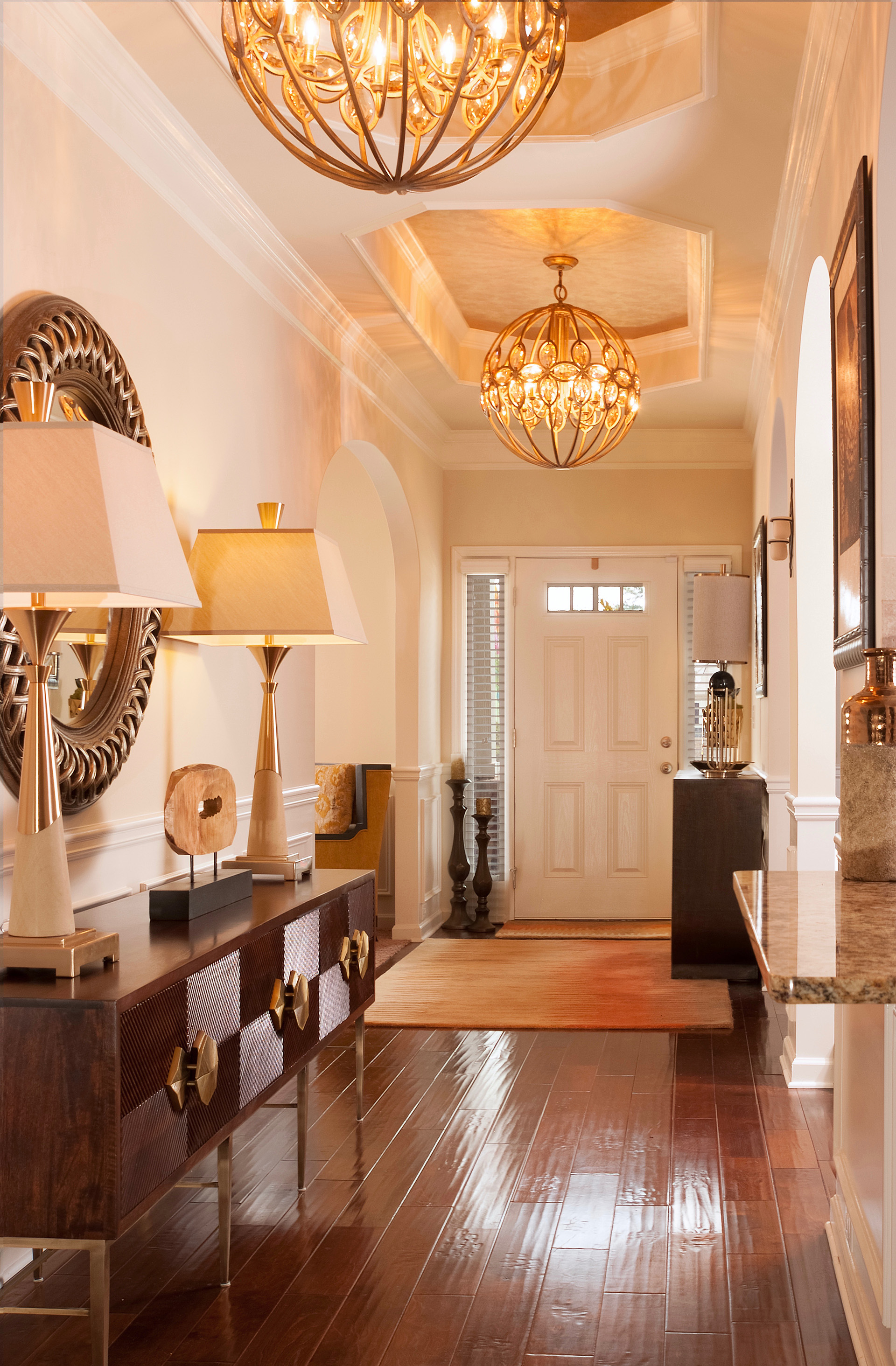 Elegant Foyer with Upscale Furnishings and Gold Accents