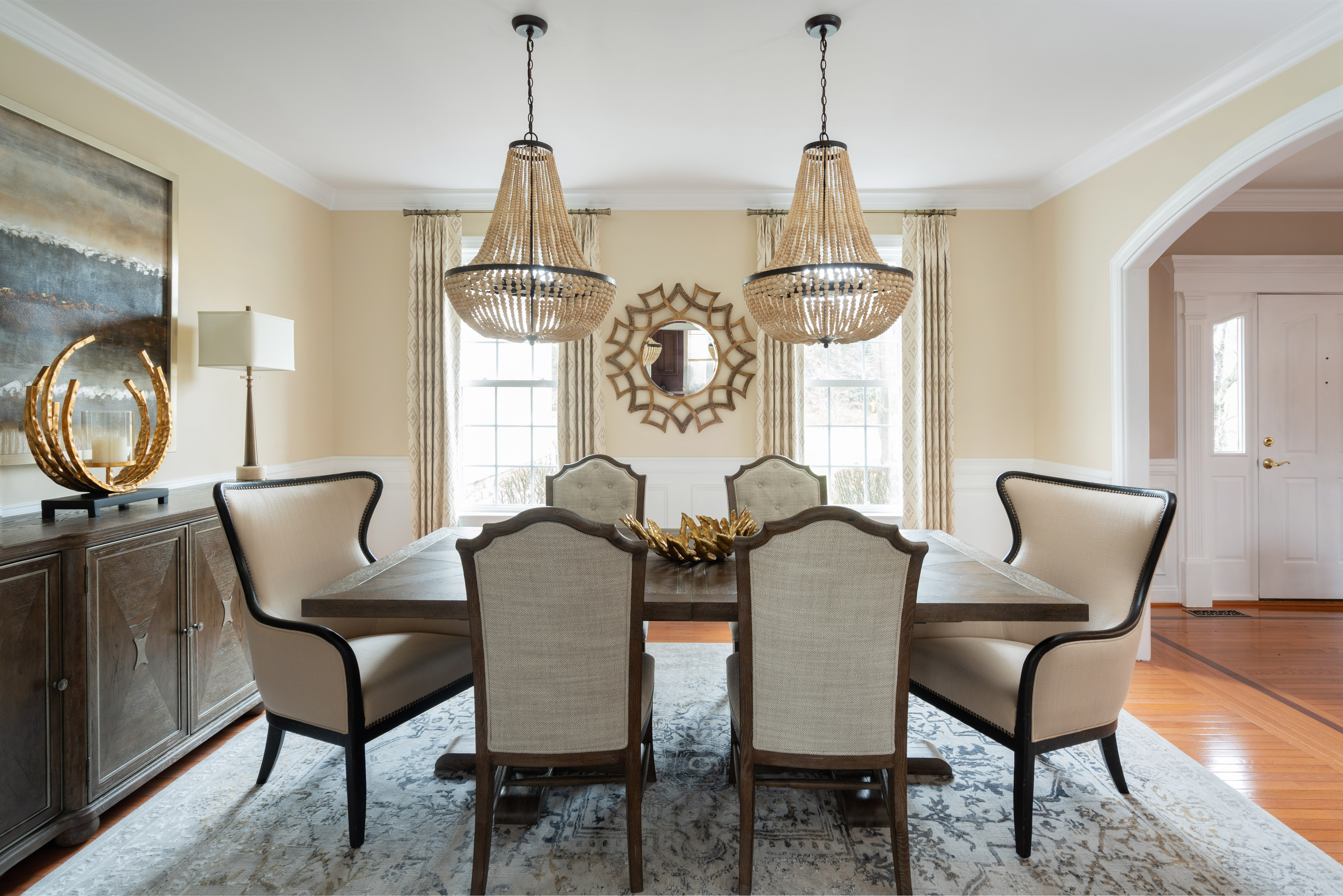 Neutral Dining Room with Bold Furnishings and Gold Accents