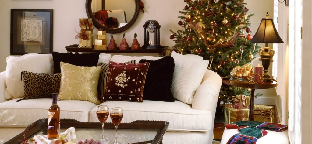 A traditional Christmas over a base of white sofas