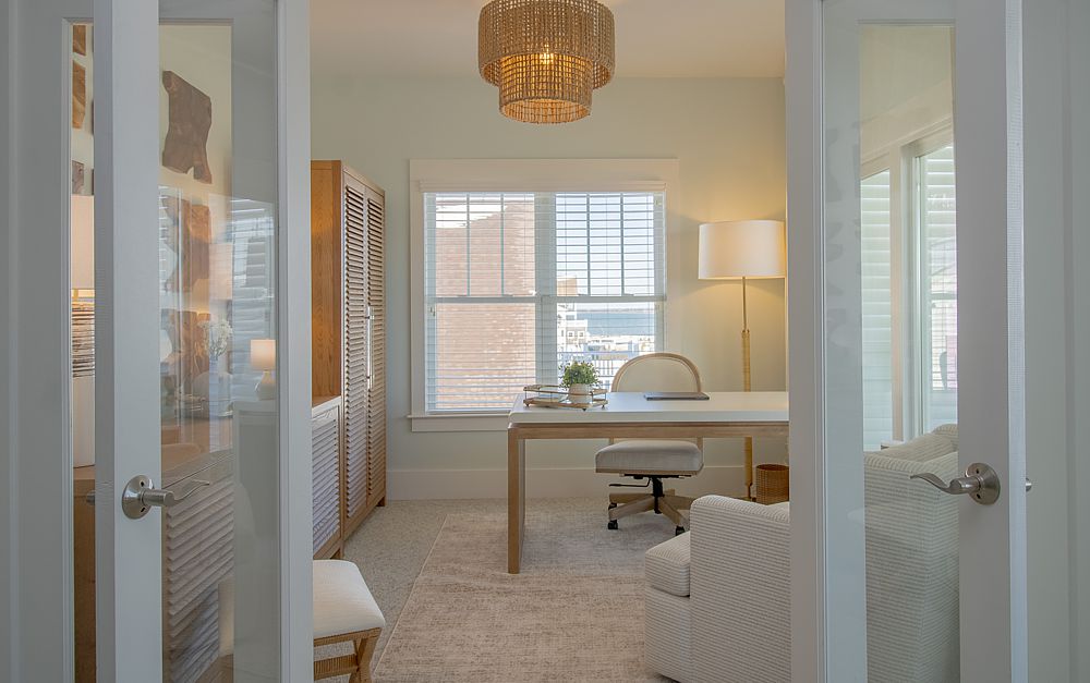 Minimalist home office featuring sleek white cabinetry and natural wood accents.